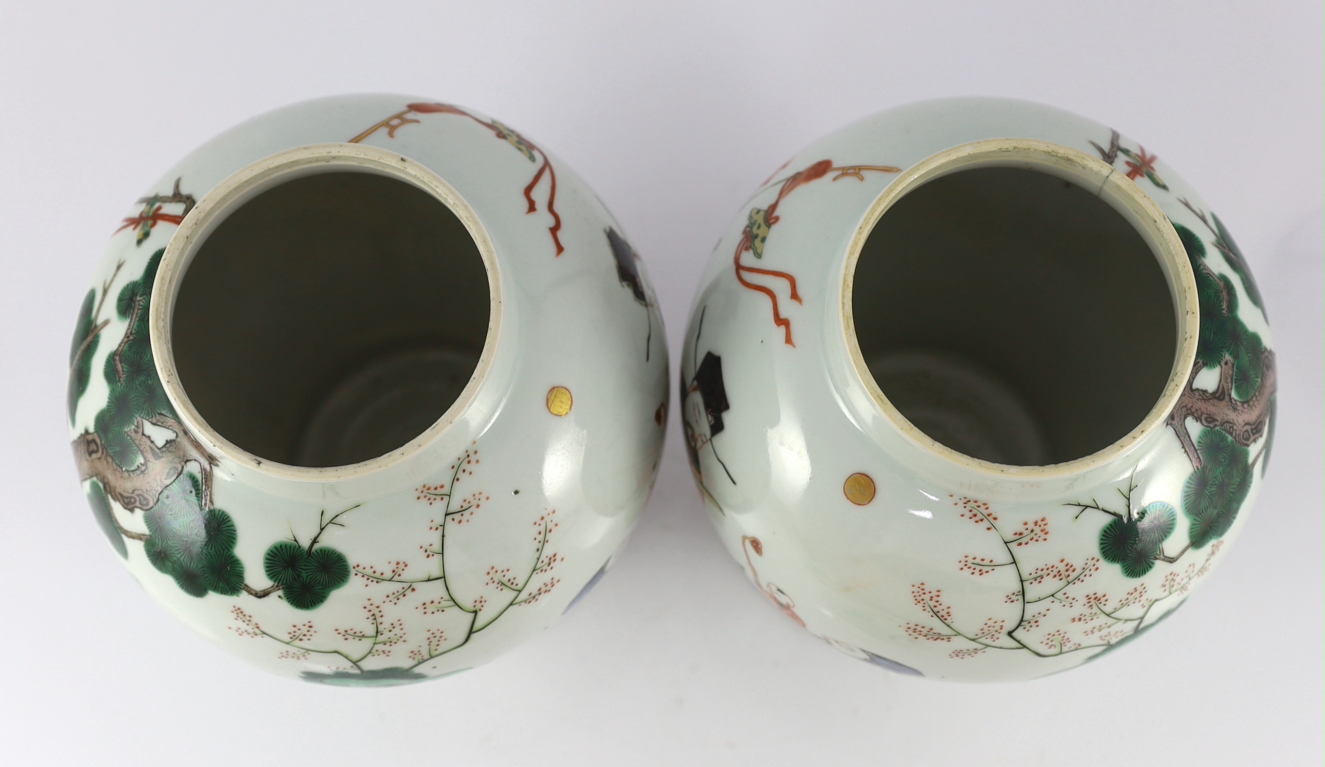 A pair of Chinese famille verte ‘Sanxing’ vases and covers, 19th century, some cracks